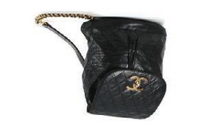 471 Chanel black duffel bag, date code for 1989-91 quilted black lambskin, rolled leather handles and gold tone hardware, 36cm wide, 23cm high 1,000-1,500 472 Chanel black patent leather shoulder bag