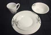 Elegant white dishes with simple black floral pattern.