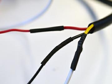 Cut off the flow meter's connector, strip the three wires inside, and solder on a long extension