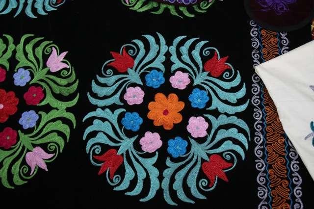 In addition to cushions, the embroidered patters from the traditional wall hangings could be used