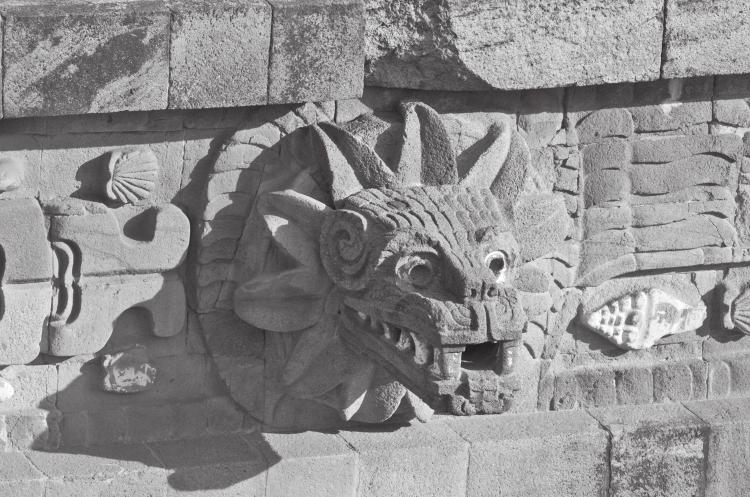 The feathered serpent depicted at Teotihuacán is thought to be a divine creature from the primordial realm, associated with both war and the sacred calendar of the world. Hemera/Thinkstock.