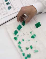 Colombian emerald cutting craftsmen closely