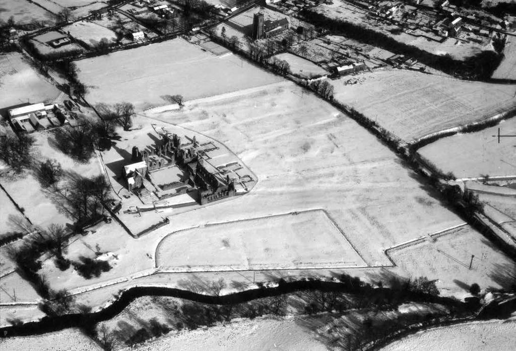Castle Acre Priory under snow showing the earthworks within the precinct with exceptional clarity.