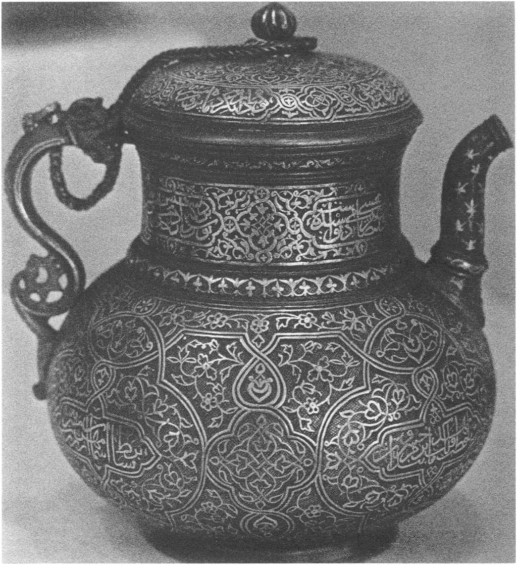 14. Jug, Timurid, dated 87 /I466, by Husayn Shams al- Din Shihab al-din al-birjandi. Brass, inlaid with silver and gold. Istanbul, Tiirk ve Islam Eserleri Miizesi, inv. no.