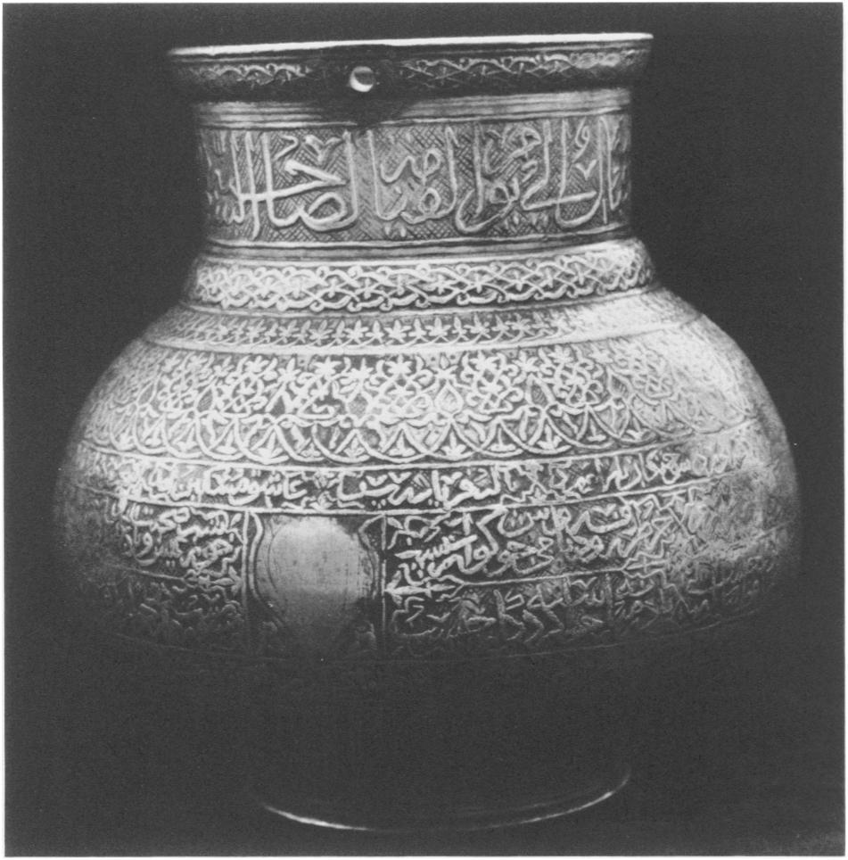 10. Jug, Timurid, dated 866/ 461-62, by Habib Allah ibn 11. Detail of Figure io showing the handle in place (photo: CAli Baharjani.