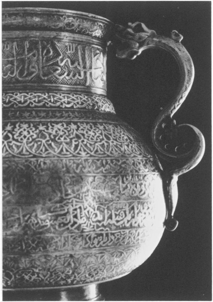 943-I886 (photo: Komaroff) body and neck is barely distinguishable from the allover patterning. These two vessels are inlaid with silver alone.