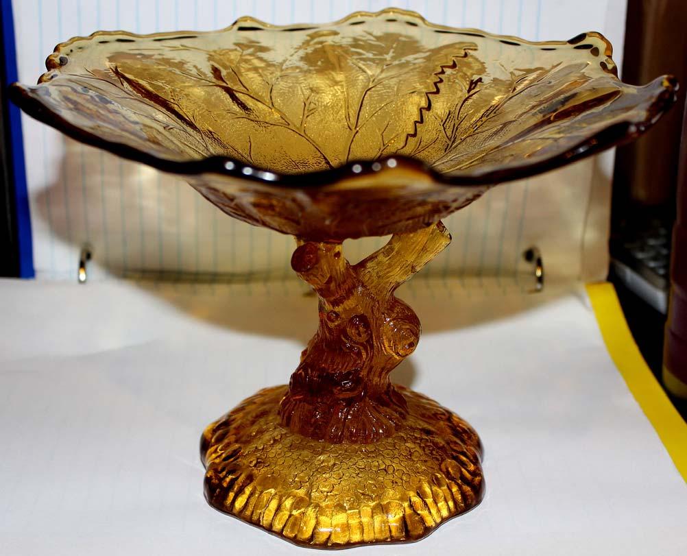 Abb. 2015-3/11-01 Bowl as a leaf with a foot as a twig, amber coloured pressed glass, leaf bowl 8 inches across [20,3 cm], hight 5 3/4 inches [14,6 cm], base 4 1/4 inch wide [10,8 cm] collection