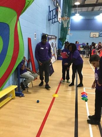 sport through helping to add up scores and explaining the rules to children.