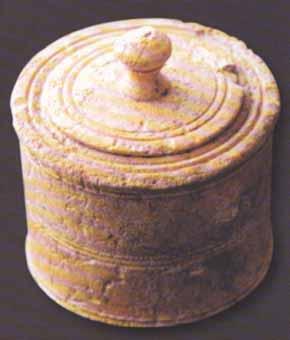 A woman kept all of her make-up in a square wooden box (arcula) with a lid, which was either separated or connected to the box with hinges.