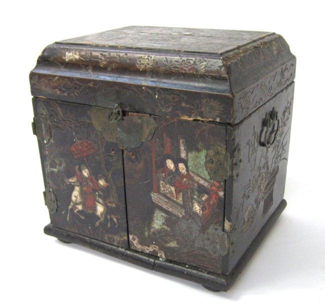 another scene of figures, the sides with blossoms, foliage and objects, red painted interior with four small drawers (painted "AI H25" in black to base) 39cm high, 39.5cm wide 100-150 221.