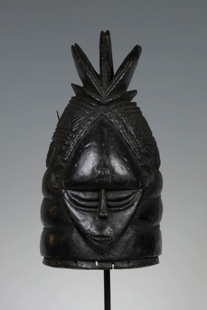 Sierra Leone; Mende peoples Gonde or sowei mask, pigment, metal 39.37 x 19.37 x 24.13 cm (15 1/2 x 7 5/8 x 9 1/2 in.) The Stanley Collection, X1986.