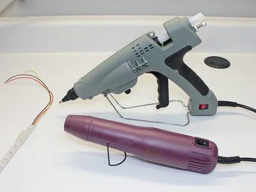 Plug in your hot glue gun and get your heat gun ready. Both of these tools use a lot of current. They should be plugged into an outlet with no other major appliances on the same circuit.