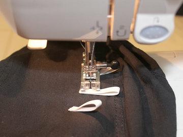 After the basting glue has dried (or immediately, if you hand-stitched them), sew the loops securely to the dorag.
