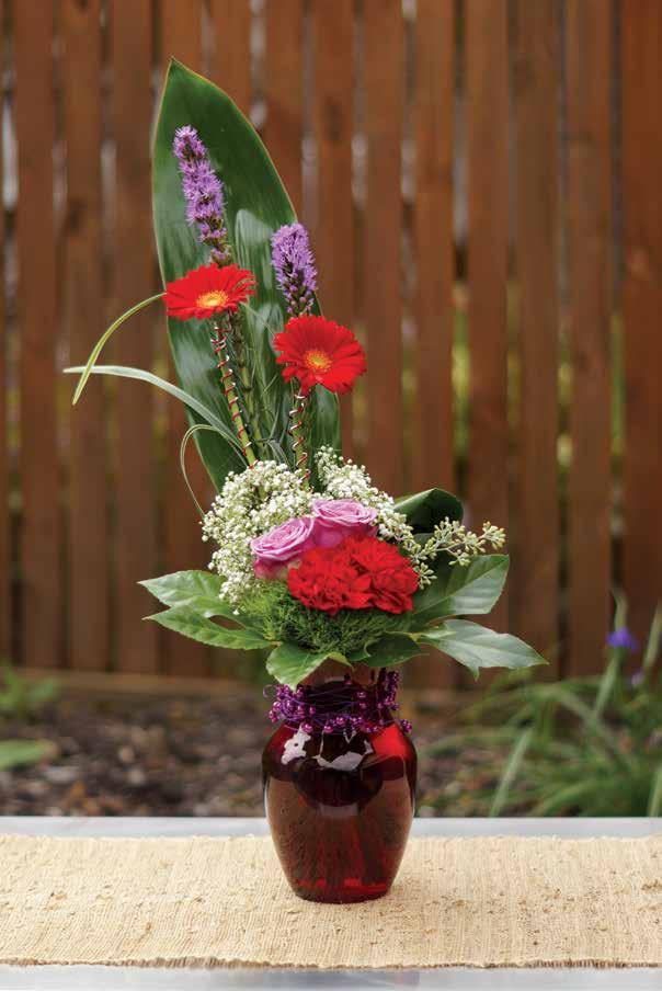 Design Recipe Rose Vase - Translucent Red (45-09999) 5' OASIS Diamond Wire - Red (40-12588) 15' OASIS Beaded Wire - Purple (2743) 2 Lavender Roses, 2 Red Carnations, 2