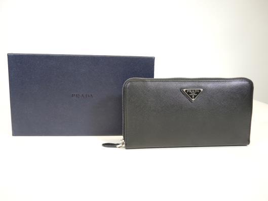 PRADA Saffiano Travel Wallet Retailed for $665, sold in one day for $249. 02/25/17 Part of Prada s current collection online, this wallet is a staple for the brand and hopefully for you too!