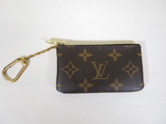 LOUIS VUITTON Key Holder Sold in one day for $99. 02/25/17 This monogram piece from 2000 is a great piece to grab out of your purse for quick trips to the store.