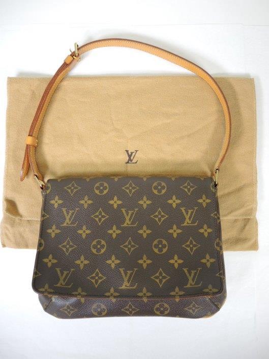 LOUIS VUITTON Musette Tango Retailed for $830, sold in one day for $399.
