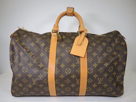 LOUIS VUITTON Keepall 45 Duffel Bag Retails for $1350, sold in one day for $749.
