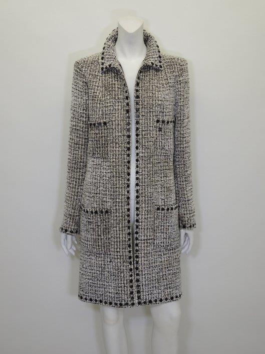 CHANEL Cream and Black Tweed Coat Size 8 Sold in one day for $1000. 02/18/17 The texture and details of this tweed coat from Fall 2003 are incredibly tactile and alluring.