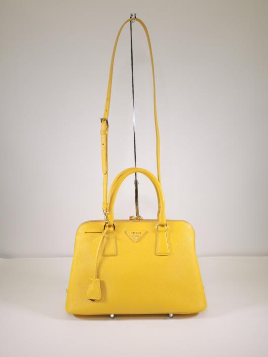 PRADA Marigold Medium Saffiano Promenade Tote Retailed for $2200, sold in one day for $1000. 05/06/17 Prada makes some of the most practical and long lasting purses in the game.