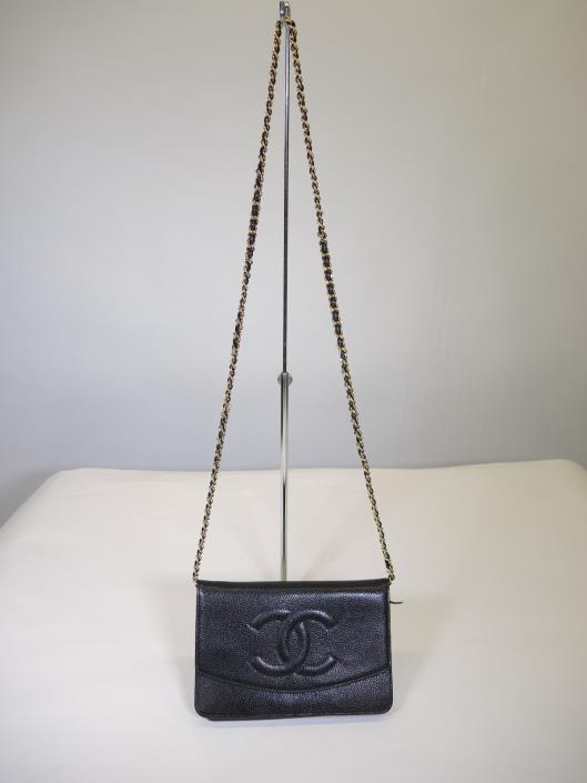CHANEL 1999 Black Caviar Wallet on a Chain Sold in one day for $1500. 04/22/17 One of the most collectible pieces that Chanel has ever made is the elusive Wallet on a Chain or, W.O.C. This black caviar leather piece is from 1999 but in impeccable condition.