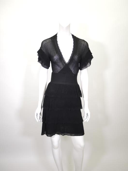 CHANEL Tiered Ribbed Knit Dress Size 4 Sold in one day for $599. 03/25/17 From 2007 s Spring season this sheer knit dress by Chanel is a perfect flirty date night piece.