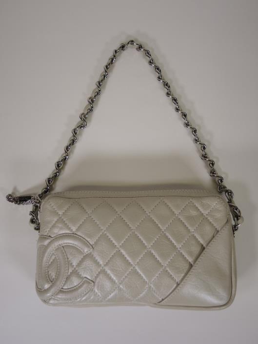CHANEL Pearlescent Leather Diamond Quilted Cotton Club Pochette Retailed for $795, sold in one day for $499. 03/18/17 The pearlized leather of this bag is a perfect color opener for the season.