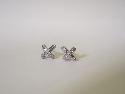 TIFFANY & CO. Platinum and Diamonds Tiny X Studs Appraised at $1650, sold in one day for $799. 03/11/17 These tiny stud earrings manage to pack quite a sparkling punch despite their 7.5mm size.
