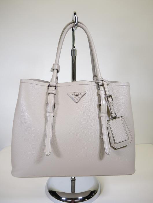 PRADA Pumice Double Bag Tote Retails for $2600, sold in one day for $1300. 02/25/16 Chanel your inner Olivia Pope with this neutral structured double handle tote.