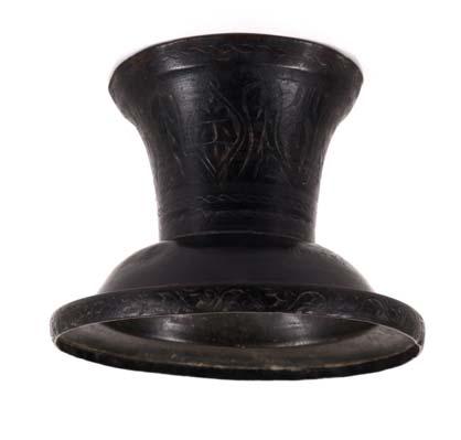34 34A 35 36 34 A NEAR EASTERN BRONZE FOOTED VESSEL Foliate designs surround the cylindrical flared foot surmounted by a shallow cup with an everted rim and small lip also adorned with a foliate
