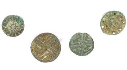 42 42 FOUR ANCIENT NEAR EASTERN BRONZE STAMP SEALS Iran, circa 2nd-early 1st Millennium B.C. Including two Bactrian examples with ring at the back, one partially openwork, 3.8cm-4.