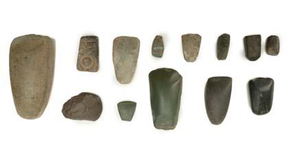 51 51 A GROUP OF NEOLITHIC STONE AXES Most with rounded cutting edge and tapering butt, with examples in grey, black and green stone, some polished, 2.
