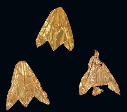 100 A PAIR OF GOLD EARRINGS Composed of elliptical shaped ring with filigree decoration, with a square pyramidal section below with filigree and granule decoration, to which three gold leaf spheres