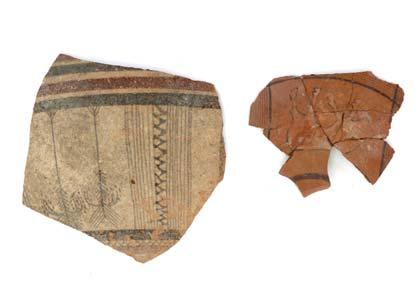 PRIOT POTTERY FRAGMENTS Circa 950-750 B.C. A fragment of a large bichrome vessel with umber and crimson bands, two stylised trees and geometric ornament of vertical lines and zig-zag design, 13.