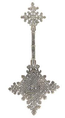 1,000-1,500 187 AN ETHIOPIAN COPTIC CROSS Late 19th Centuryearly 20th Century A fine example of a silver plate hand cross with an engraved reticulated design and an