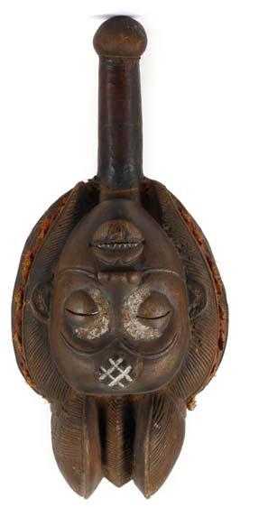 206 206 TWO BRONZE FINIALS Two short shafts with carved decoration are topped with bearded male heads wearing pointed headdresses, With an animal