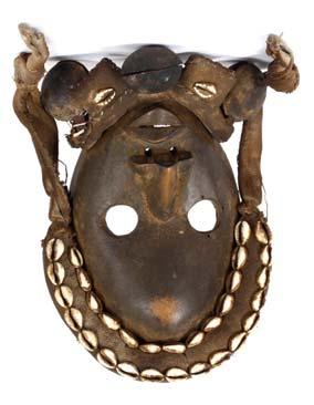 225 TWO WOOD MASKS The first of rounded shape with large hollow eyes and an off-centre mouth with bared teeth, 23.