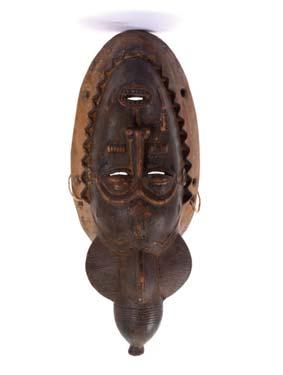 Provenance: The property from the collection of Siegfried Soucek, acquired between 1968 and 1972. 225 226 TWO WOOD DAN MASKS, IVORY COAST Including one with inlaid silver eyes, 22.