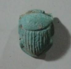 would mitigate against this. Both areas in the court produced a range of faience finds, with a wellpreserved scarab and a baboon amulet of Hapy, one of the sons of Horus.