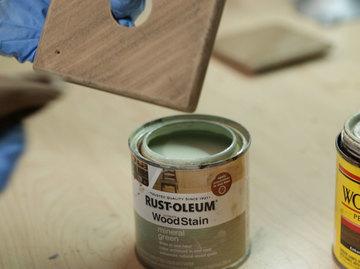 Give the enclosure depth by applying a second lighter coat of stain.