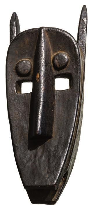 CLAMRA CÉLESTIN FIG. 8 (right): Hyena mask. Bamana, Mali. Ex Lance Entwistle, London. FIG. 9a and b (below): Large head. Lobi, Burkina Faso. Ex Alan Brandt, New York; Michael Oliver, New York.