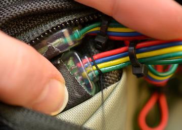 Attach the pixels by stitching the wires to the front surface of the bag.