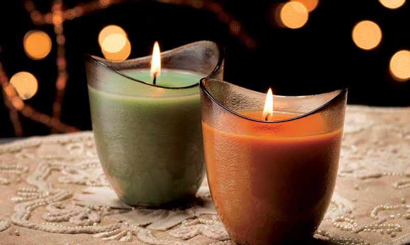 BURNING BRIGHTLY Sun Valley Candles add a festive touch to any room and come in two delightful holiday fragrances: Mint Chocolate Truffle and Candied Harvest.