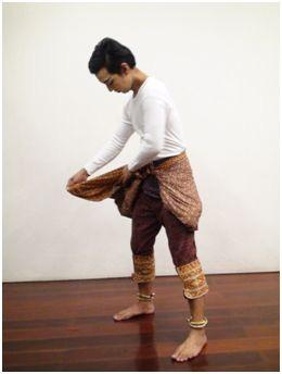 Figure 3. The hero wearing the pa pawk Step Four: The pre-stitched pa nung is wrapped around the performer by a costume artist.