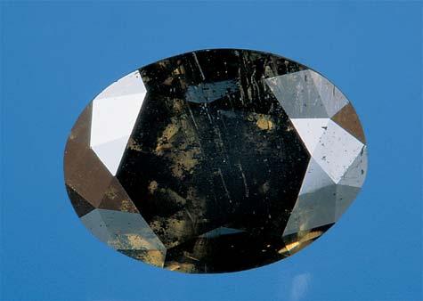 Figure 13. This heavily included faceted synthetic moissanite (approximately 8 mm long) was reportedly made in Russia using a vapor deposition process.