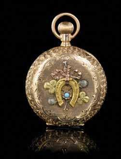 within a white, rose and green gold foliate surround, case back depicting a yellow horseshoe within a rose, yellow and white gold ribbon and foliate surround, central round cabochon cut turquoise