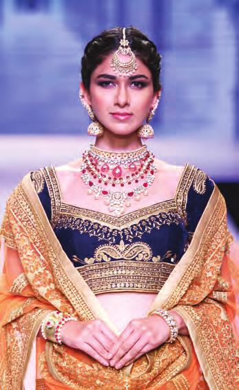 A white and green Swarovski encrusted bracelet, ear cuffs with pearl centres, an intricate neckpiece and an impressive tiara were some of the stunners on the catwalk.