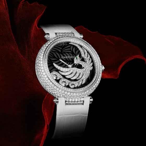 The winged figure on the dial of the Envoi d Un Phoenix watch, coated with brilliant-cut diamonds, is also the rotor, winding the movement as it swings around the mother-of-pearl dial.