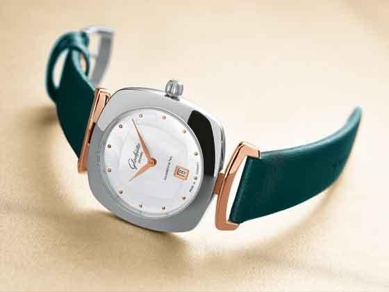 A two-tone Pavonina with petrol green satin strap The collection s highlight is a model with