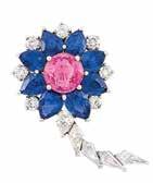 52 51 53 49 50 54 49 Platinum, Pink Sapphire, Sapphire and Diamond Flower Brooch entering one round pink sapphire approximately 3.90 cts., encircled by 8 pear-shaped sapphire petals approximately 6.